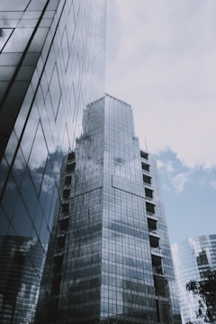 Commercial office buildings with glass facades reflecting the city skyline.