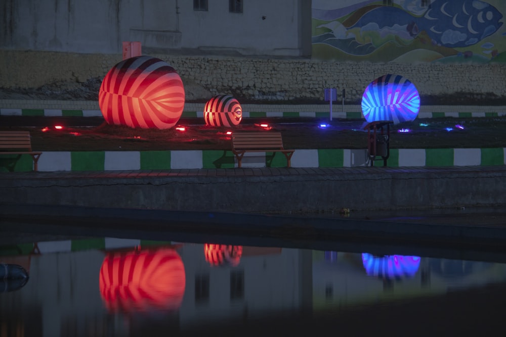 red and blue-lighted balls