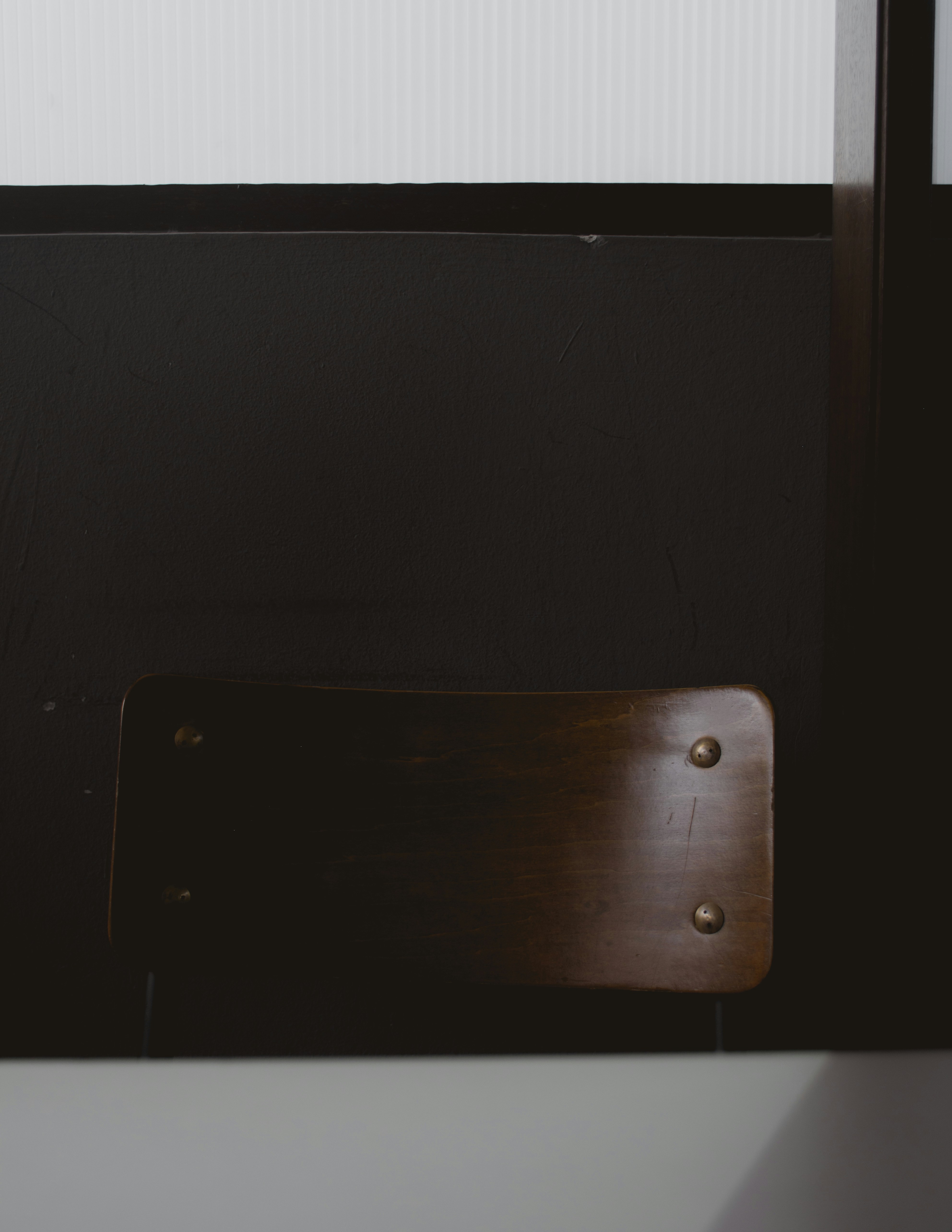 a close up of a chair near a window