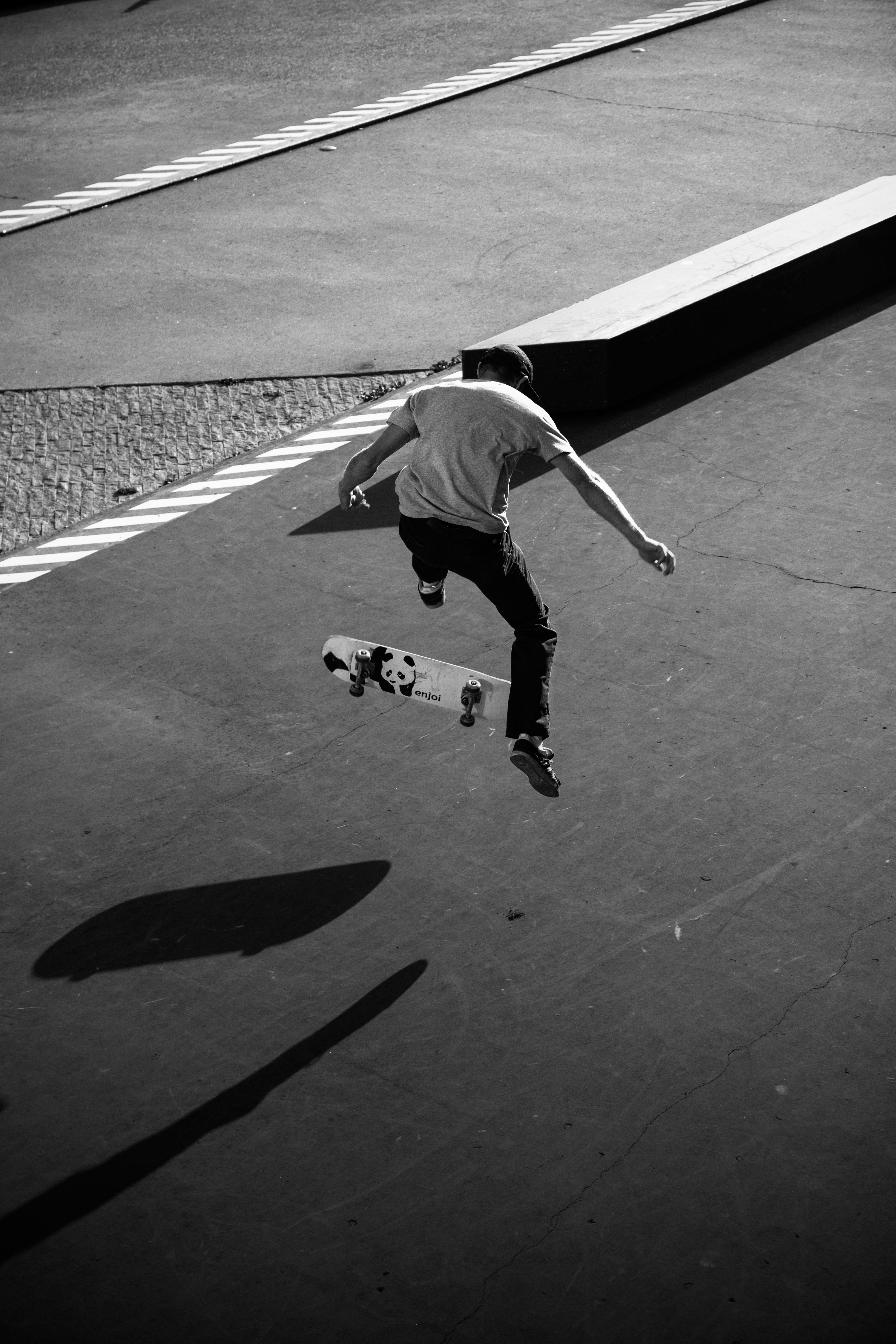 grayscale photography of man skateboarding