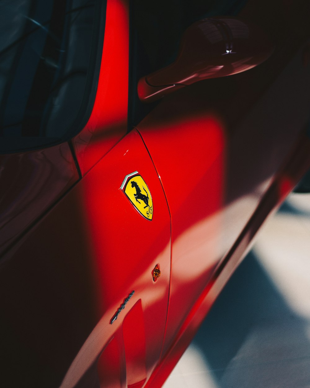 red Ferrari vehicle