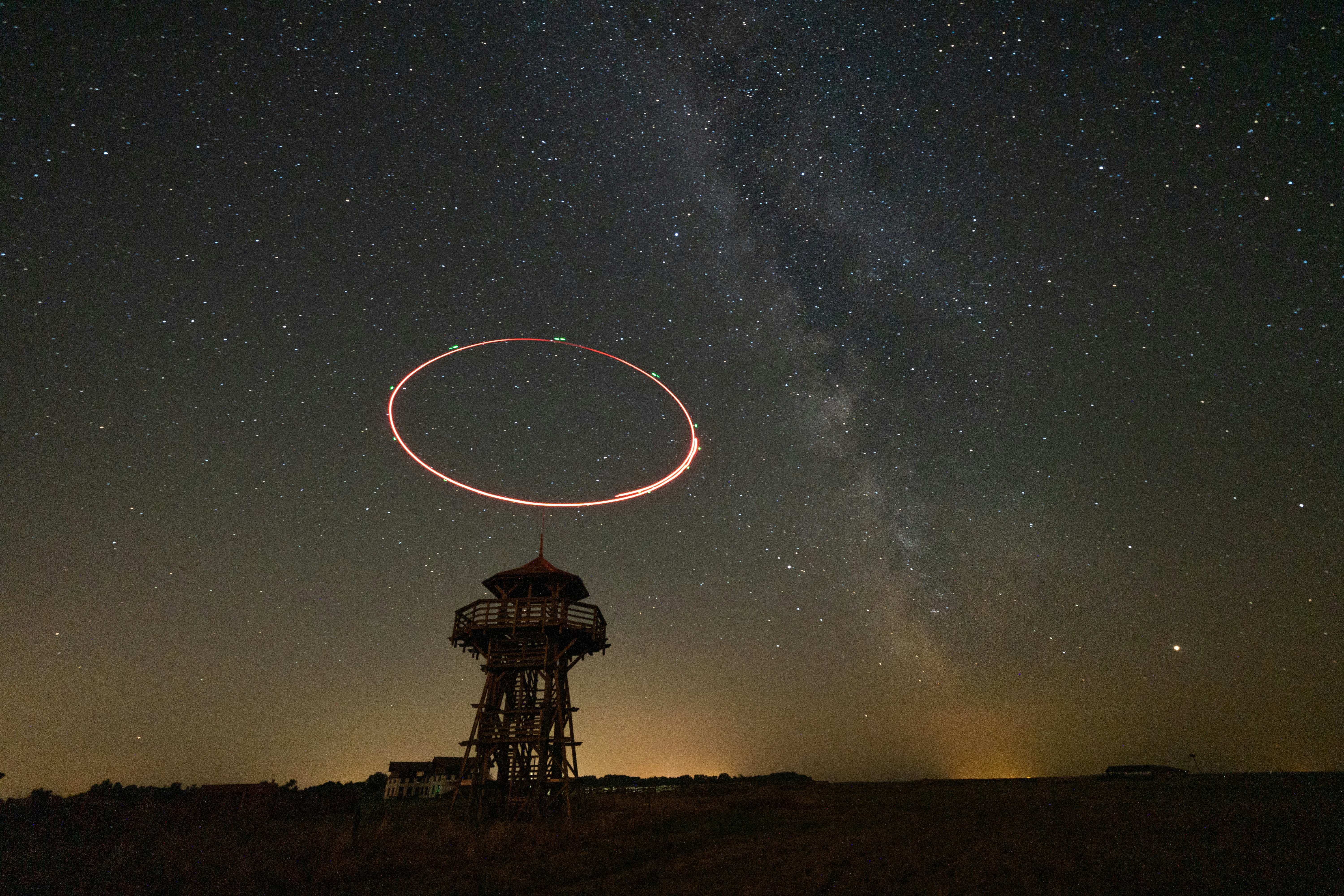 ring of light over tower at night
