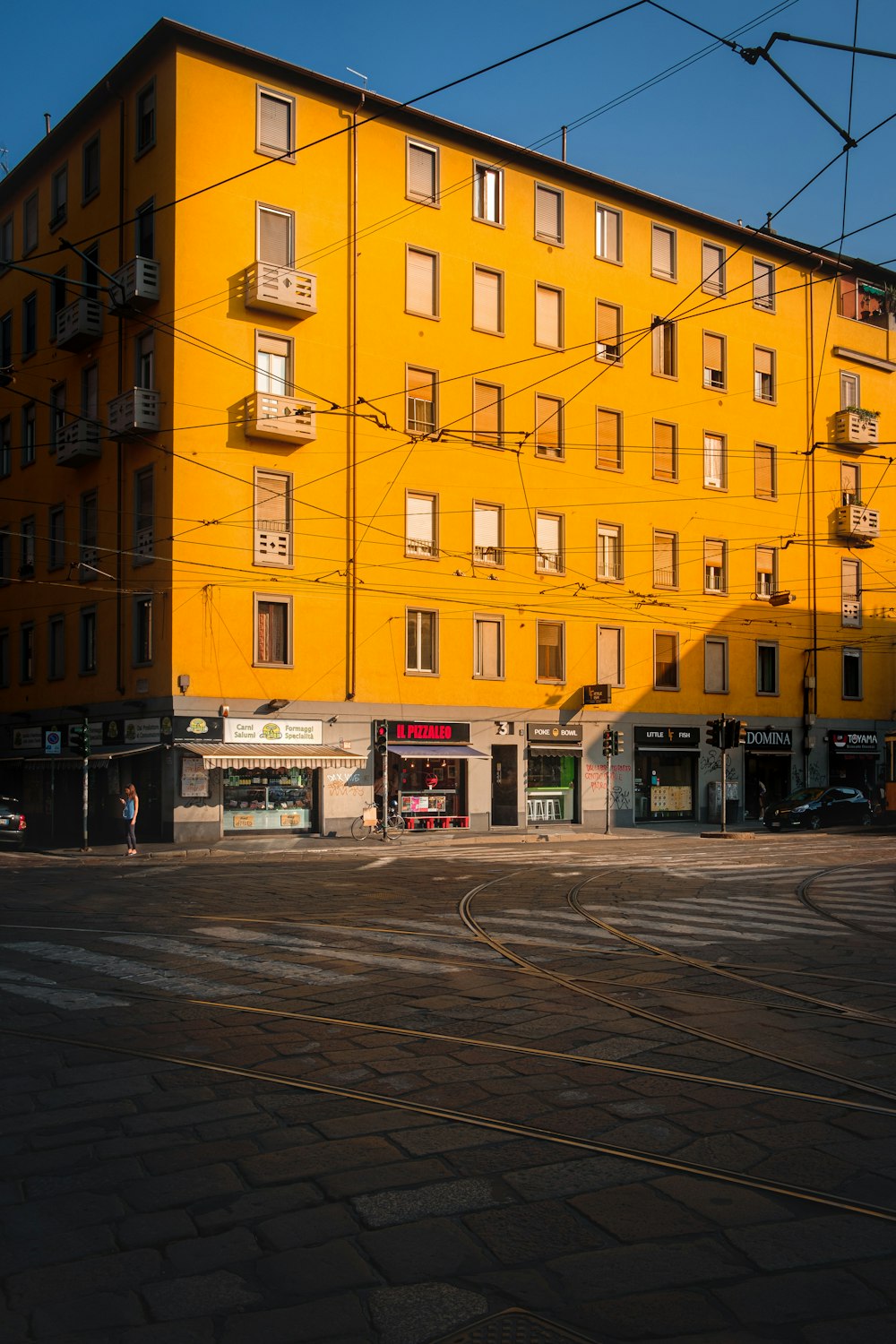 yellow and gray concrete high-rise building