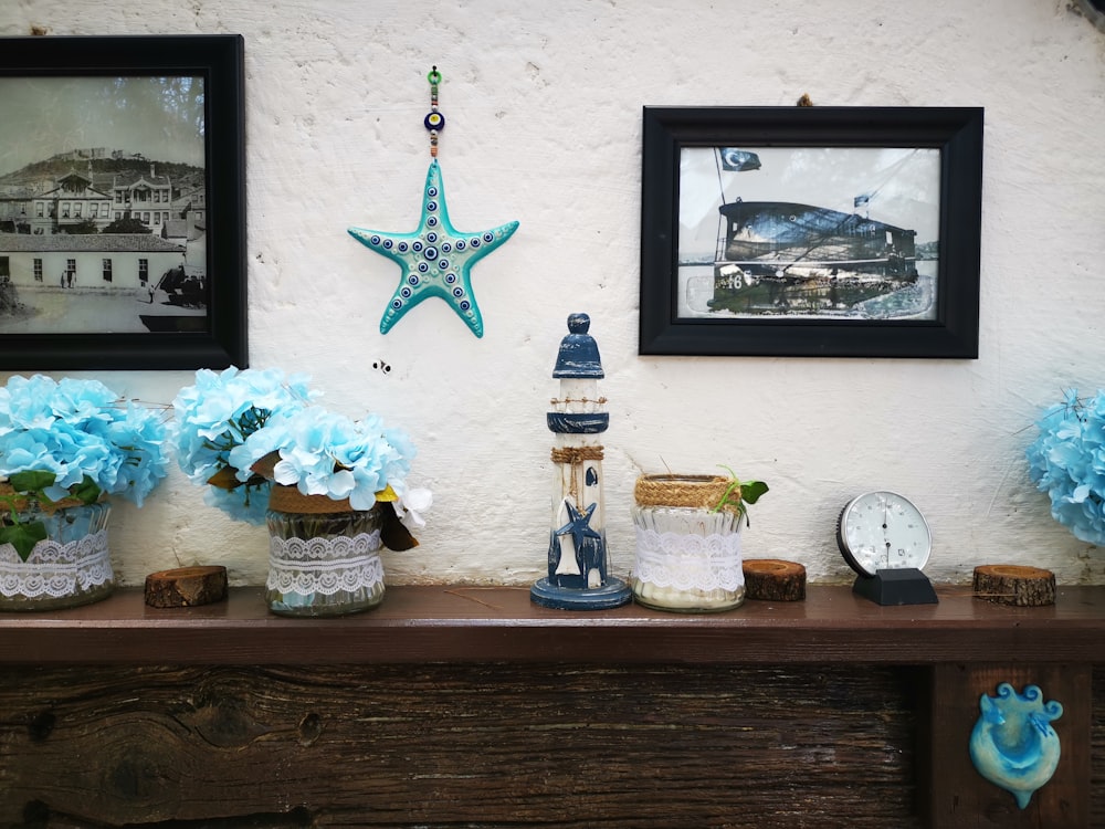 white and blue lighthouse ceramic miniature on brown wooden table