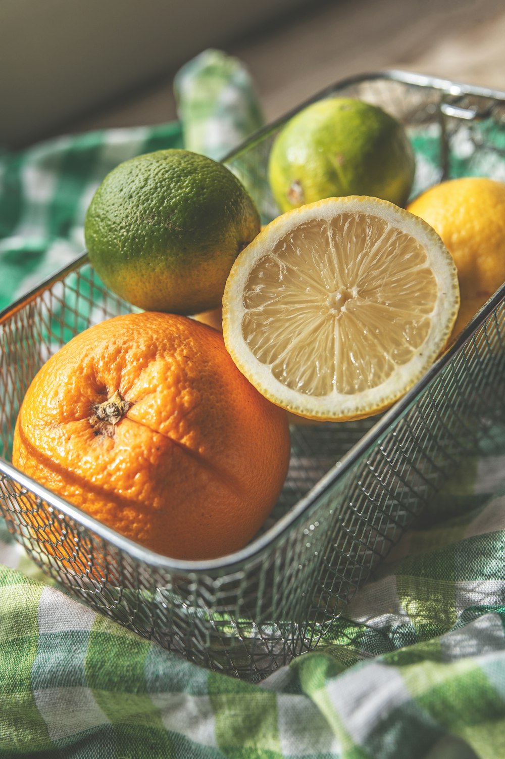 lemons and oranges in basket