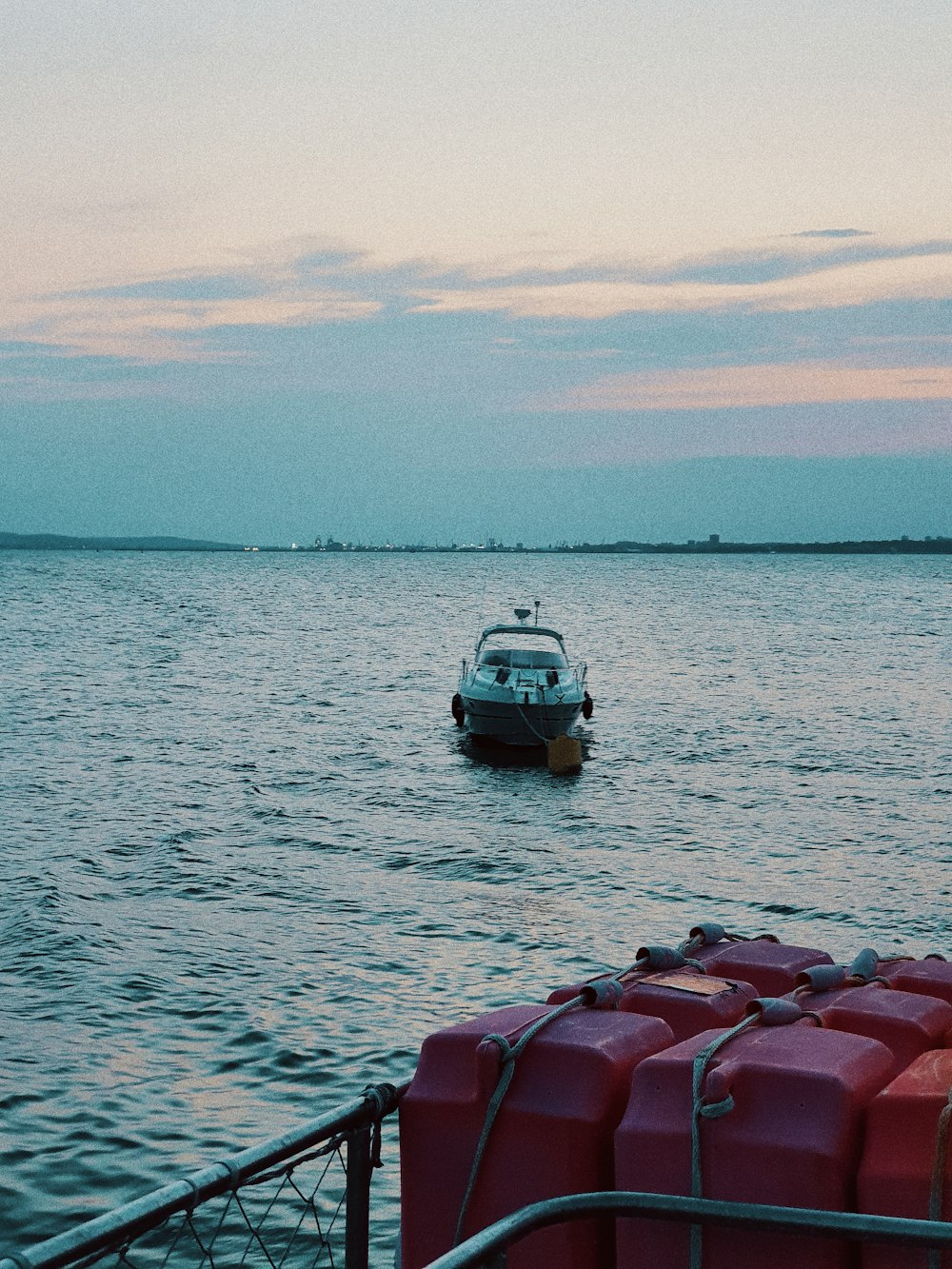 white and gray powerboat on body of water during daytime