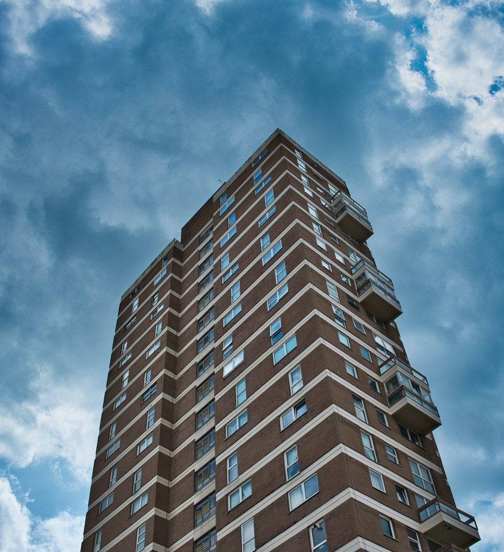 low angle photo of brown concrete building during daytime