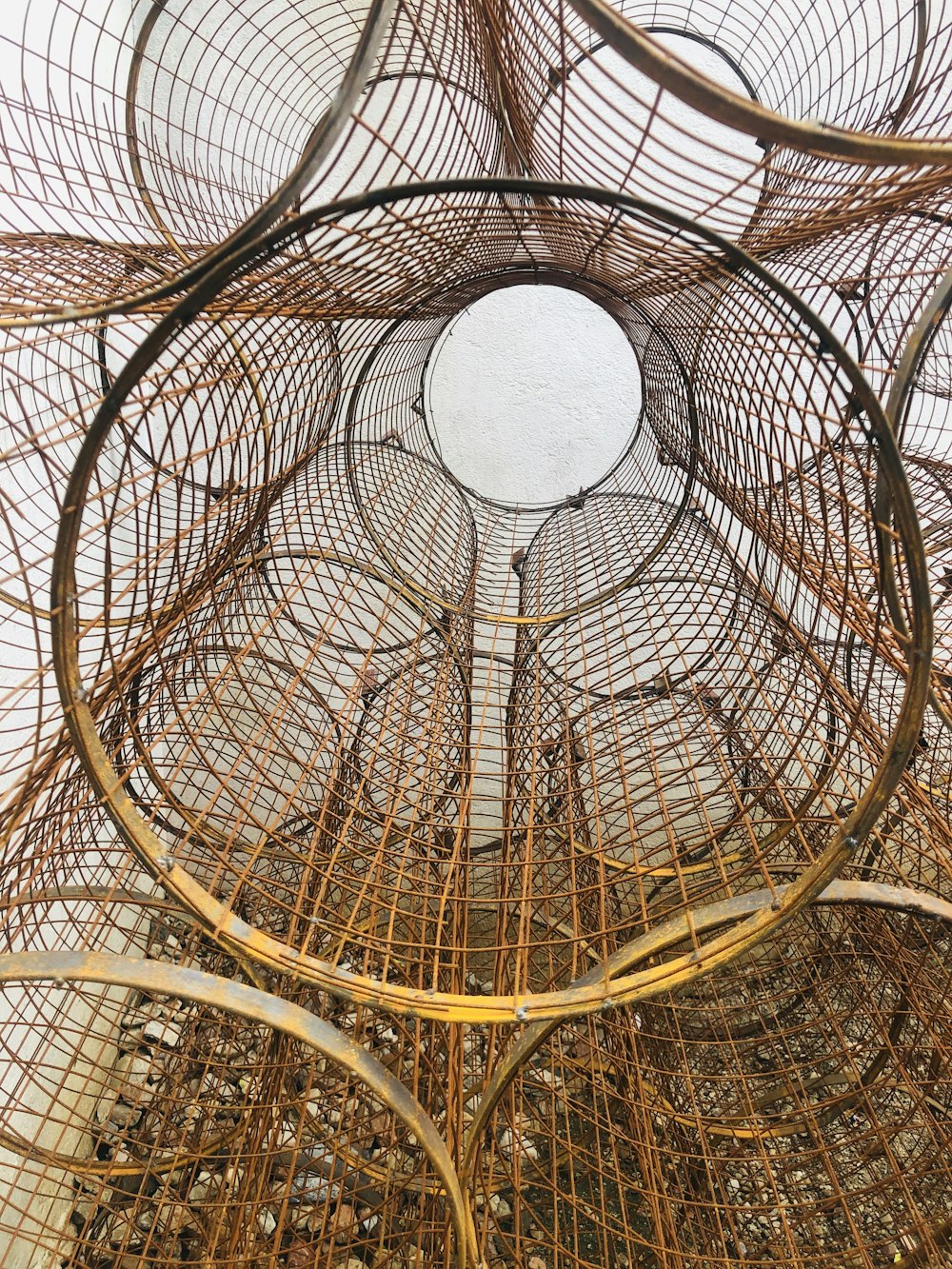 a bunch of wire baskets stacked on top of each other