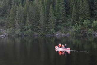 Instructor guiding a small group of beginners during a calm morning canoe lesson.