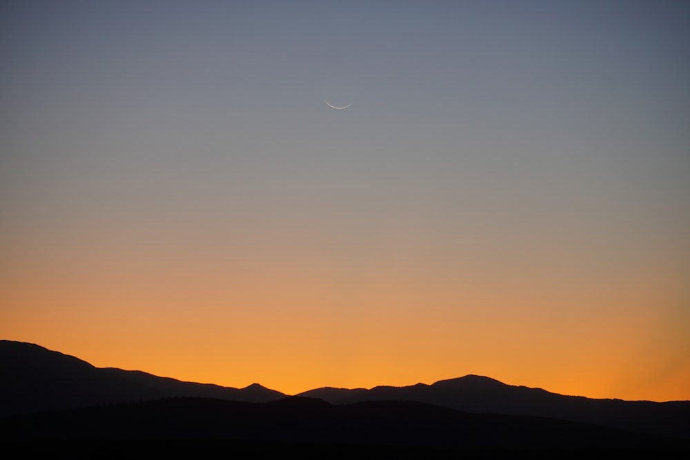 silhouette of mountain during golden hour