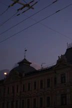 Warm evening view of Coin Harvey House illuminated against a twilight sky.