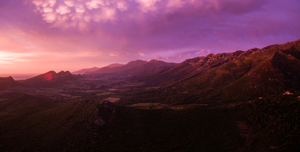 mountains under white clouds