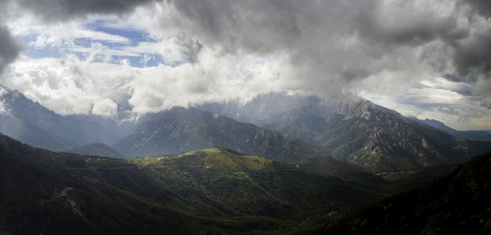 mountains under white clouds