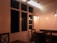 A welcoming restaurant dining area with wooden tables and soft natural lighting.