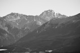 Monochrome image of a mountain peak symbolizing stability and heritage.
