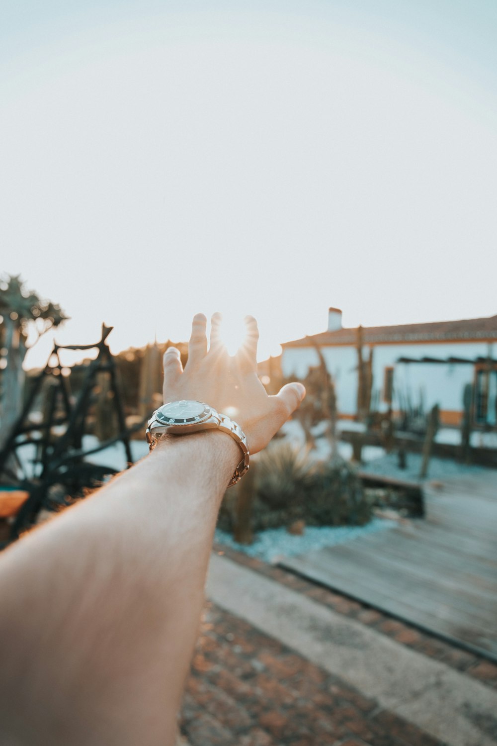 person with round white analog watch