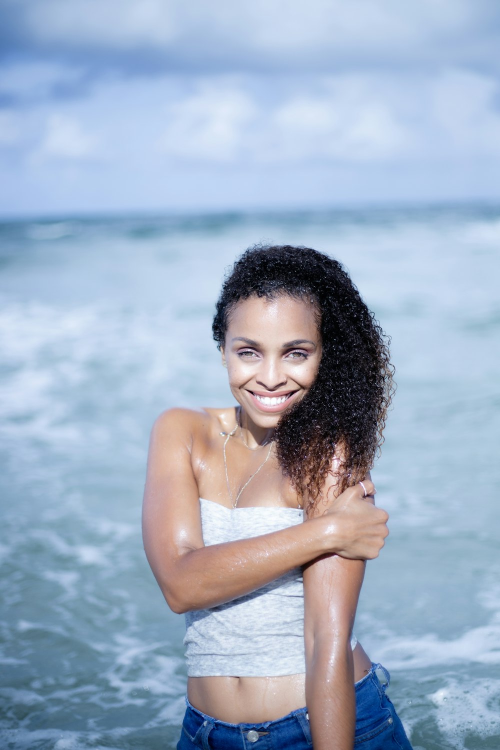 smiling woman on body of water
