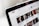 A close-up view of a computer screen displaying a YouTube page, showing the logo and multiple video thumbnails in a recommended section.