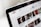 A close-up view of a computer screen displaying a YouTube page, showing the logo and multiple video thumbnails in a recommended section.