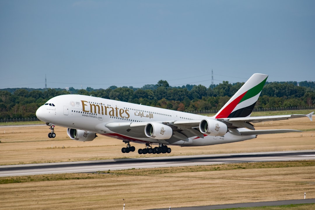 white Emirates aircraft,