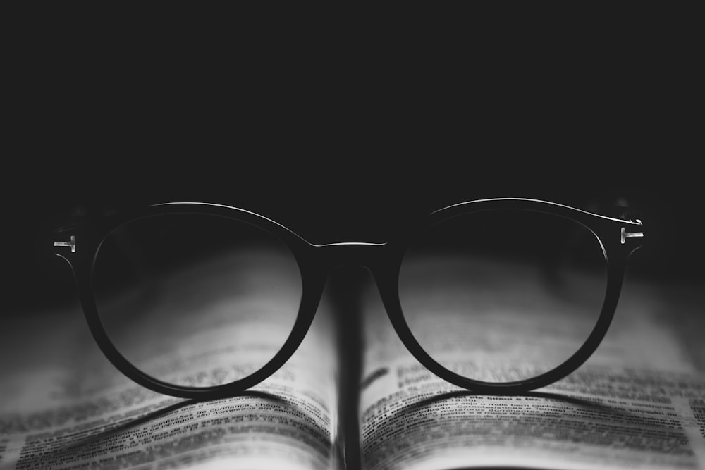 photo of eyeglasses on book page