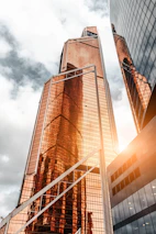 Modern high-rise buildings bathed in golden sunlight, symbolizing premium property investments.