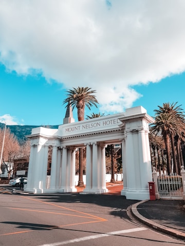 Mount Nelson Hotel arch under cloudy sky