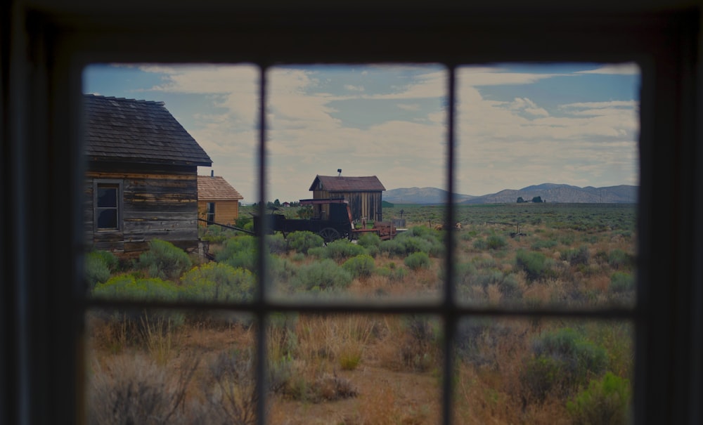 glass panel window across brown and yellow houses