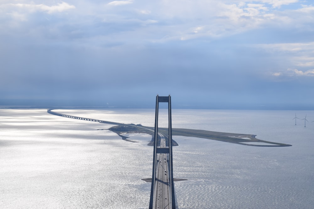 photo of gray and maroon bridge aerial view