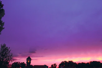 A peaceful sunset with purple and yellow hues, symbolizing new beginnings and connection beyond walls.
