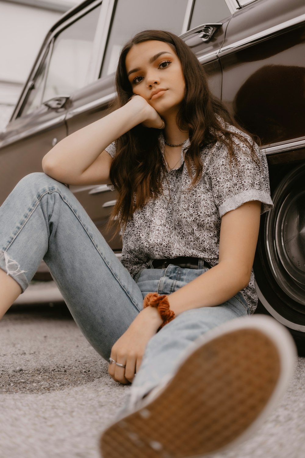 woman leaning on sedan