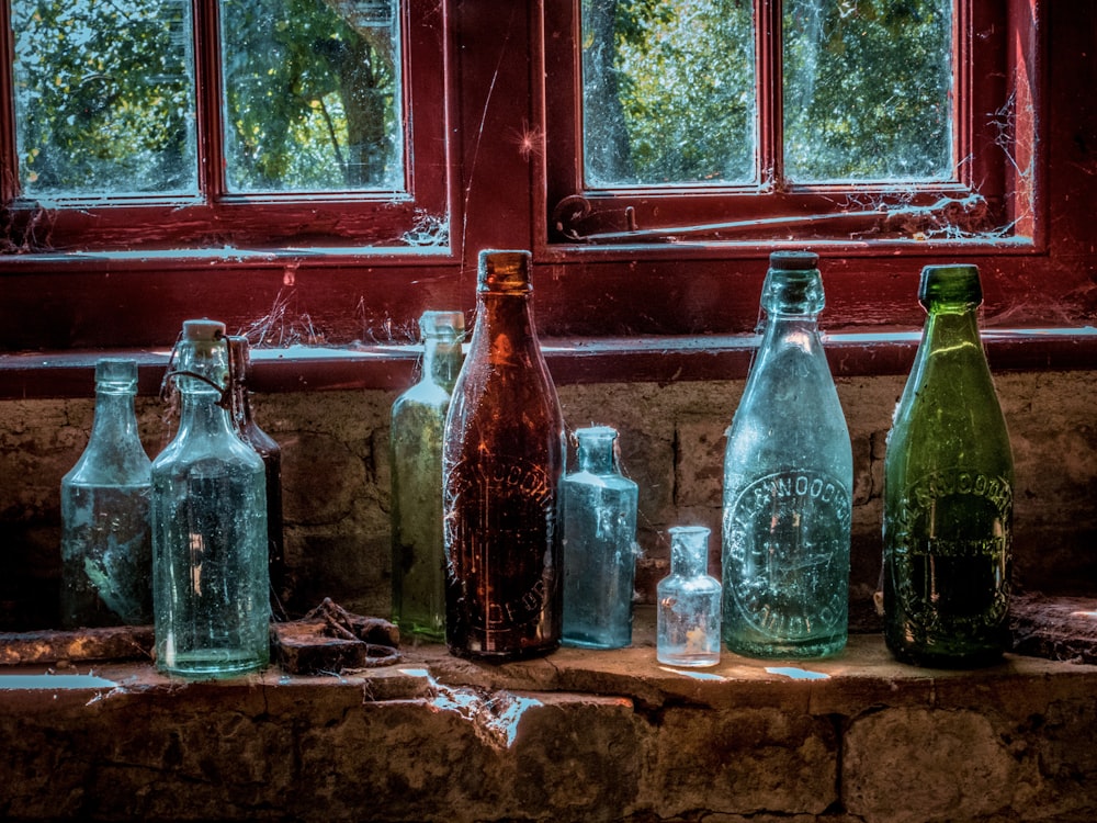 assorted-color glass bottles