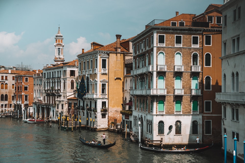 canal and buildings during day