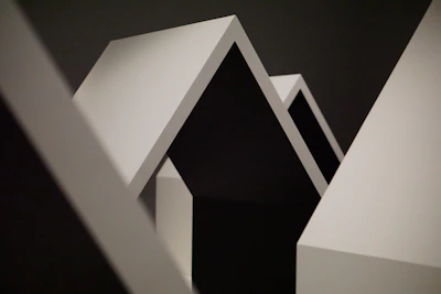 Clean geometric shapes in grayscale reflecting balance and precision.