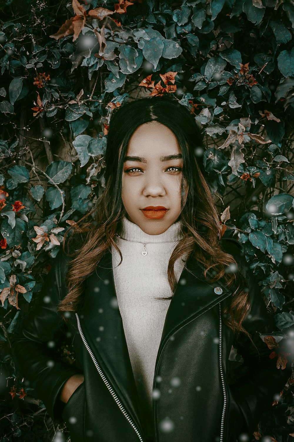 woman in beige turtleneck sweater top and green jacket