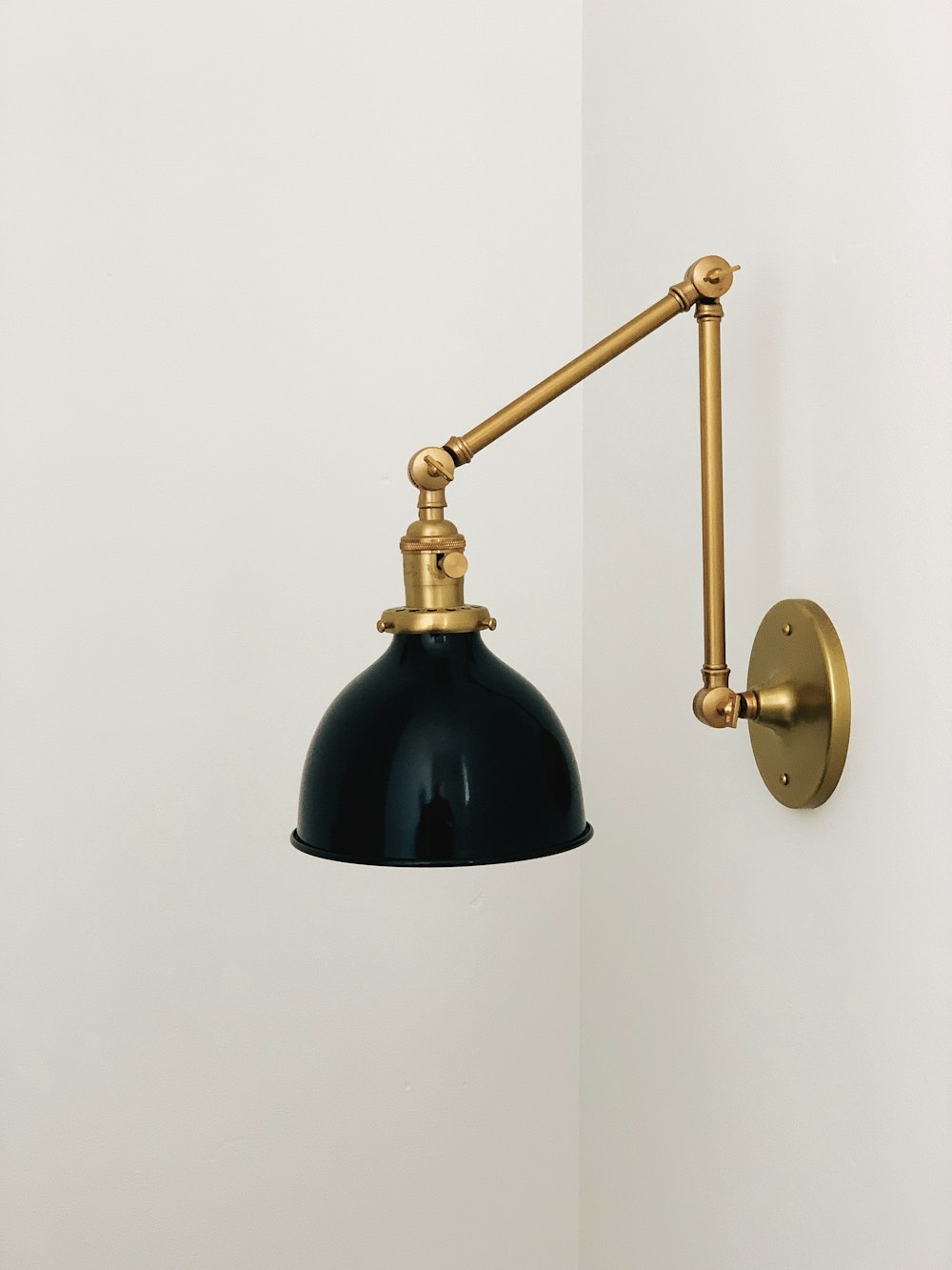 black and gold sconce
