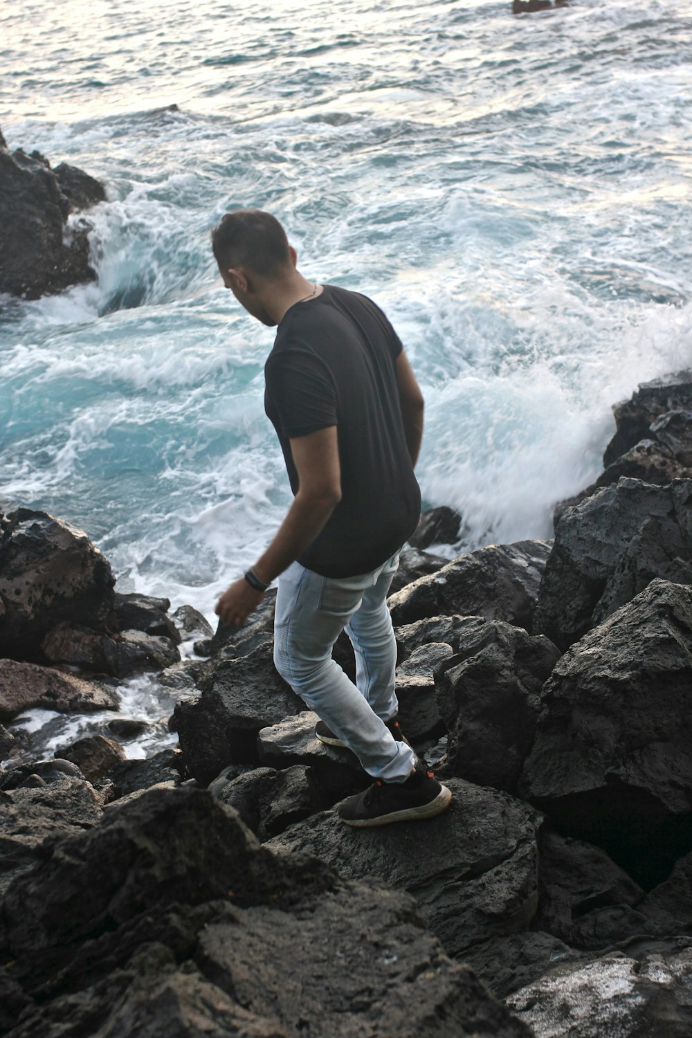 man standing on rock