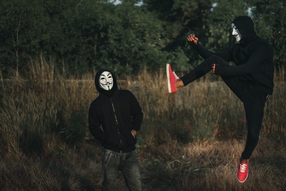 men wearing guy fawke masks