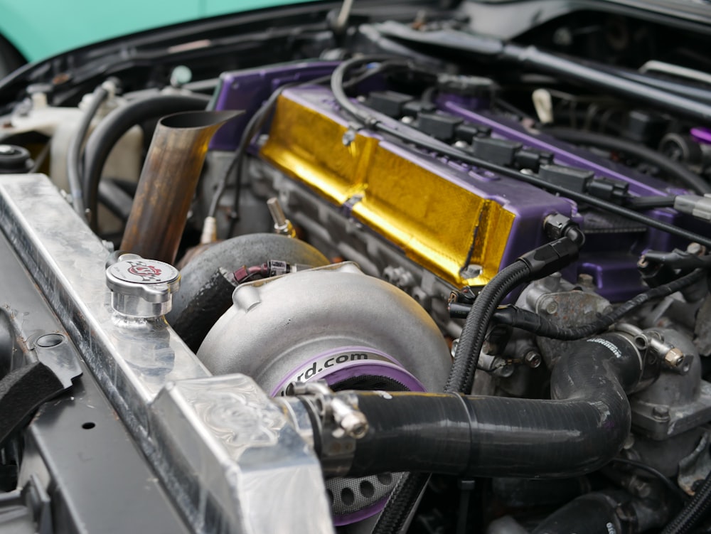 shallow focus photography of black and gray car engine bay