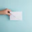 person showing white envelope