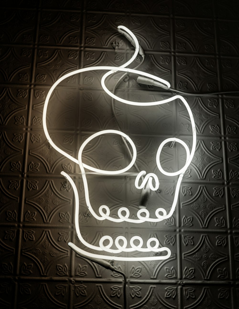 human skull neon light signage