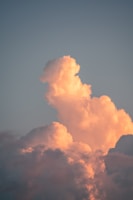 Close-up of delicate cloud formations glowing under morning light.