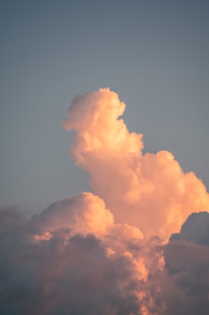 Close-up of delicate cloud formations glowing under morning light.