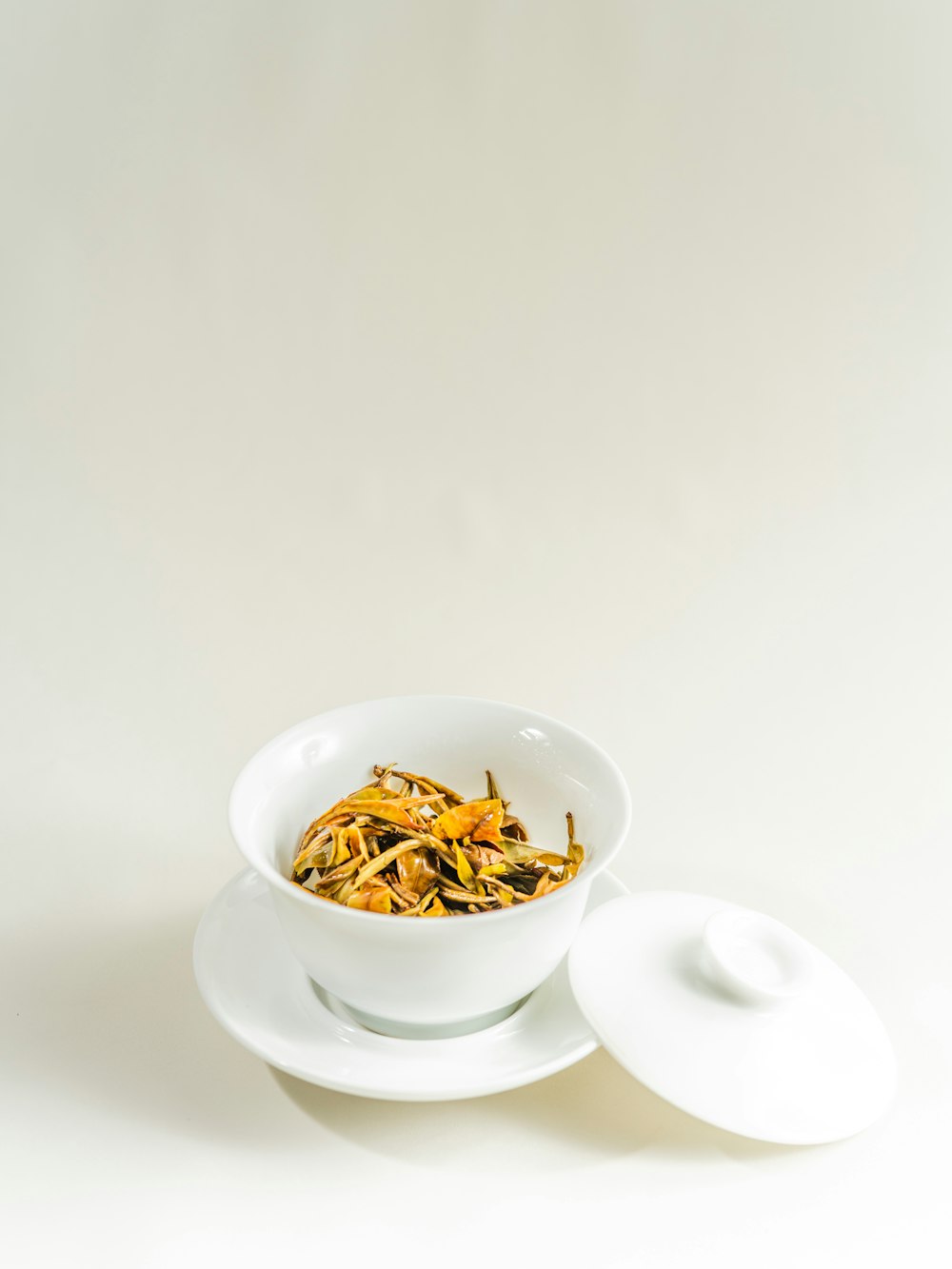 white ceramic bowl on saucer