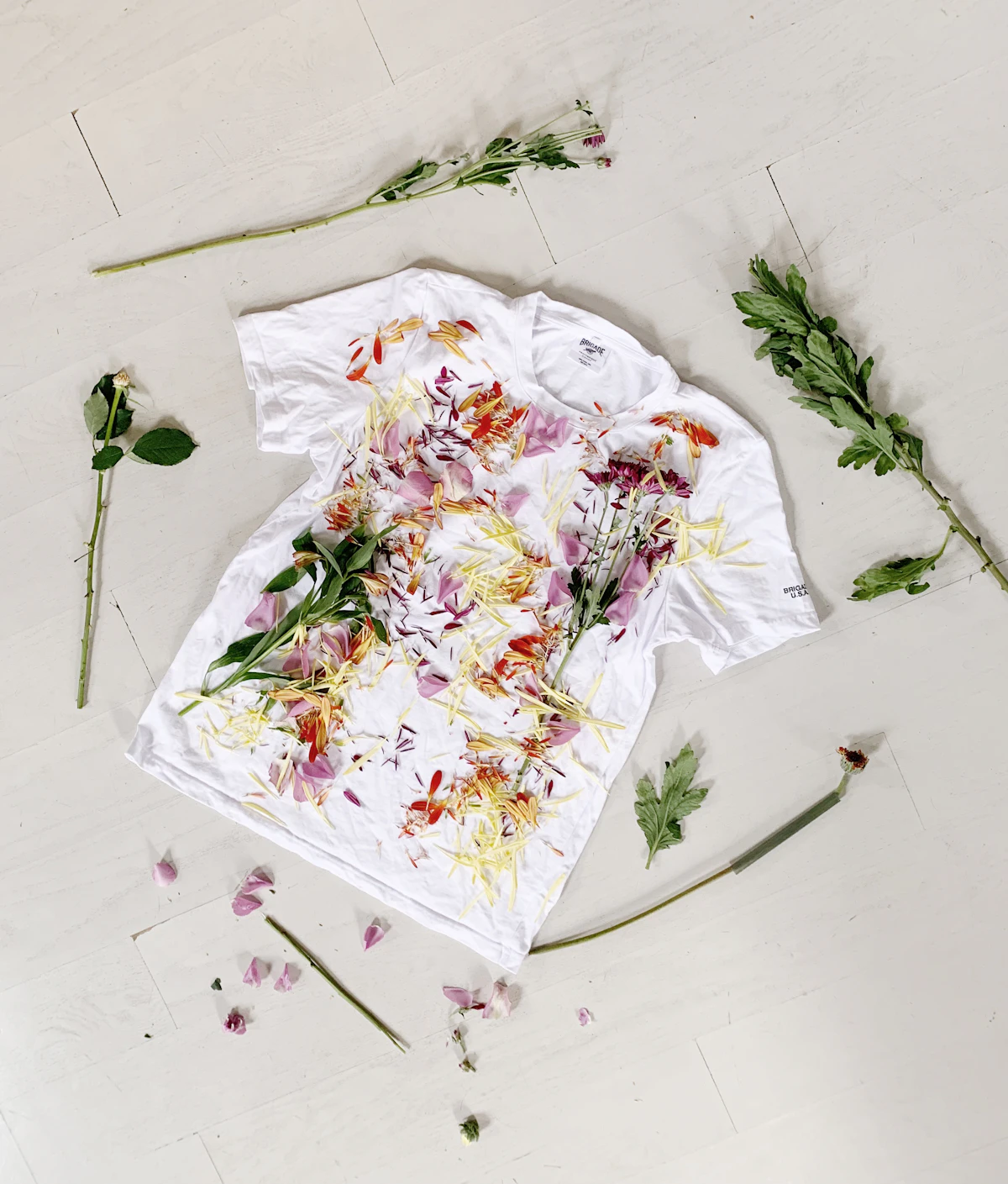 Linen shirt flat lay with dried flowers