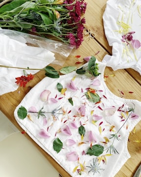 white and pink floral textile