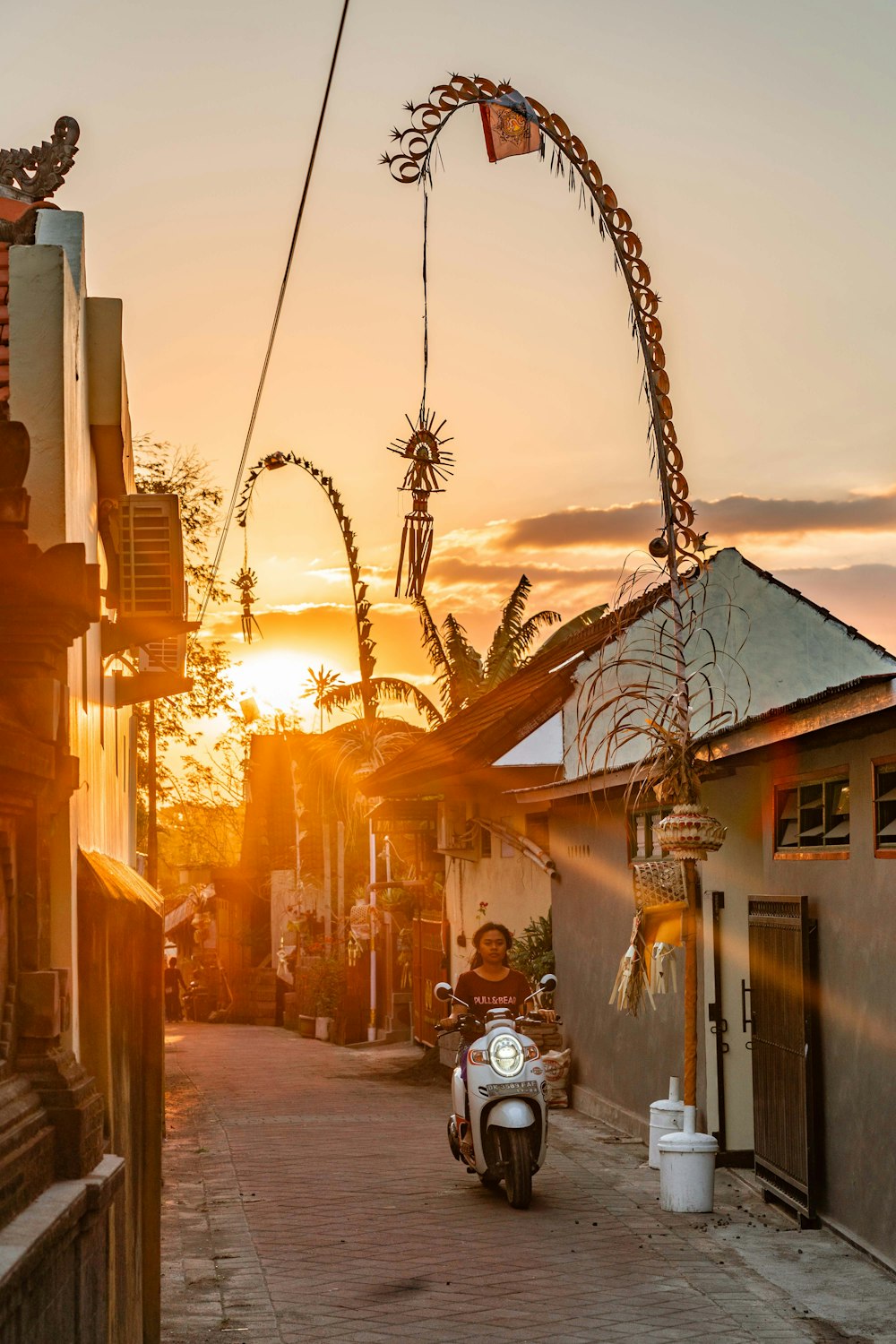 woman in scooter on alley