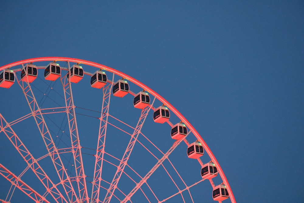 orange ferris wheel during daytime