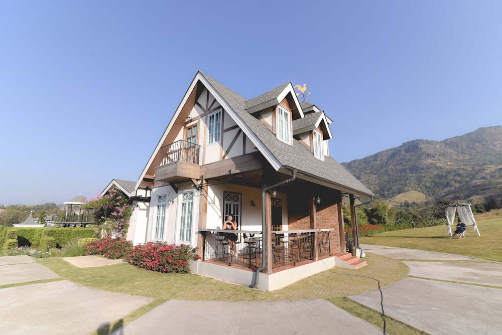 white, gray, and brown house under blue sky