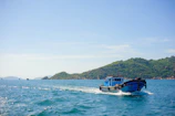 Turquoise waters of Far North Queensland with a fishing boat cutting through gentle waves